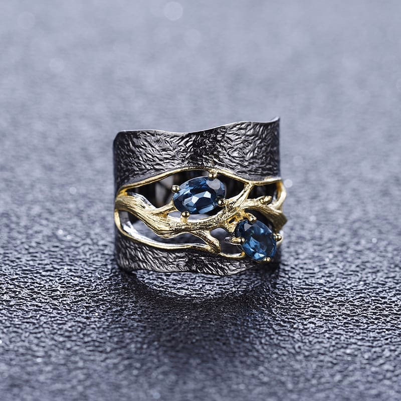 Breiter Schwarze Ring mit London Blue Topas